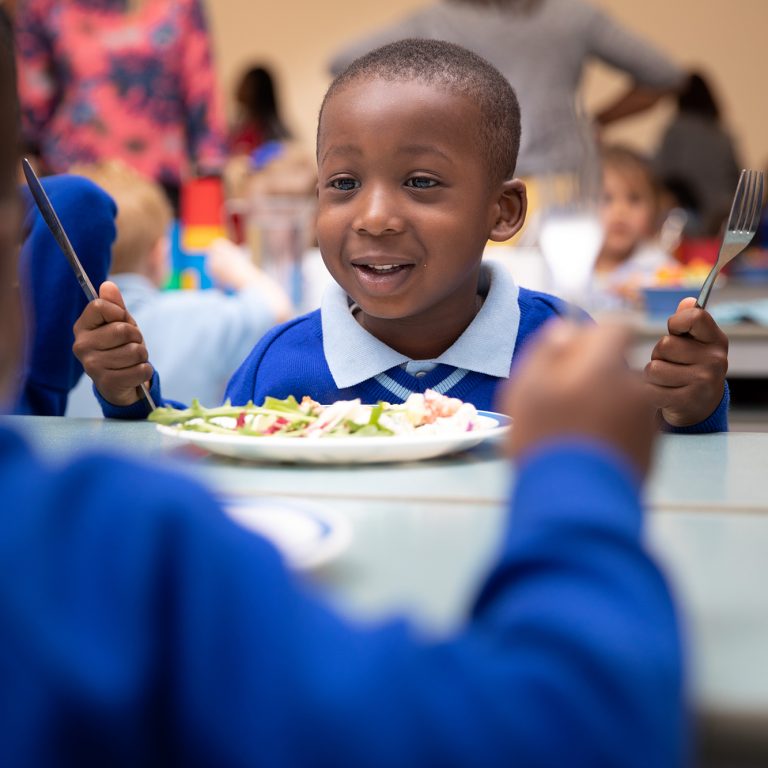 children eating lunch with a knife and fork