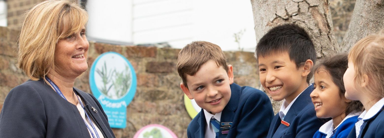 children at school talking to teacher