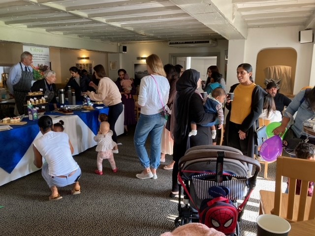 Avon House Bake Sale with parents and younger children