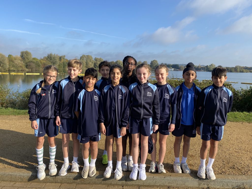 Students in sports clothes by the Lake