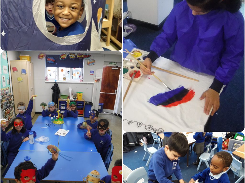 Students painting a space rocket using arts and crafts