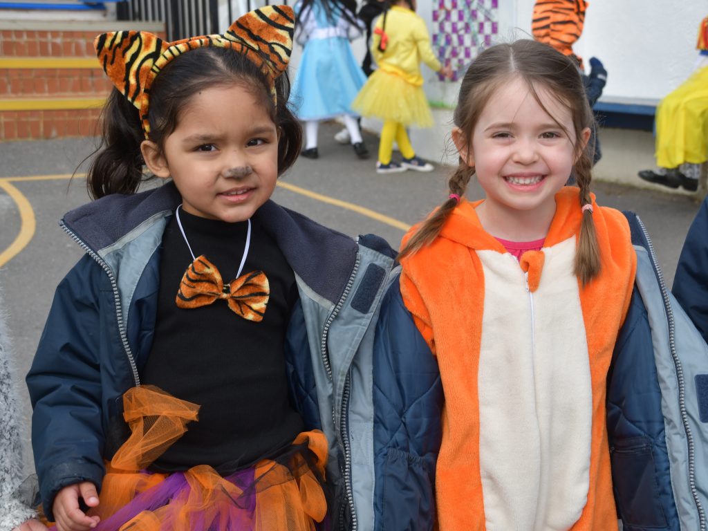 2 girls wearing tiger costumers at the World Book Day event