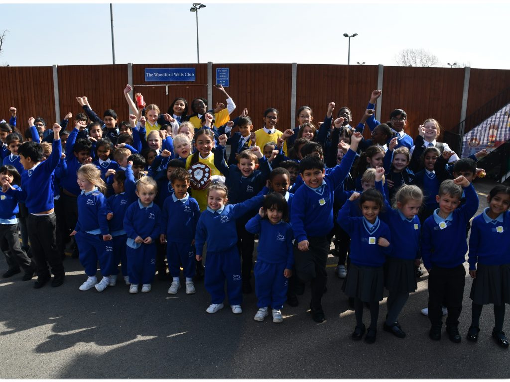 Students waving