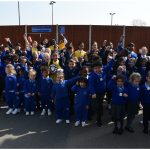 Students waving