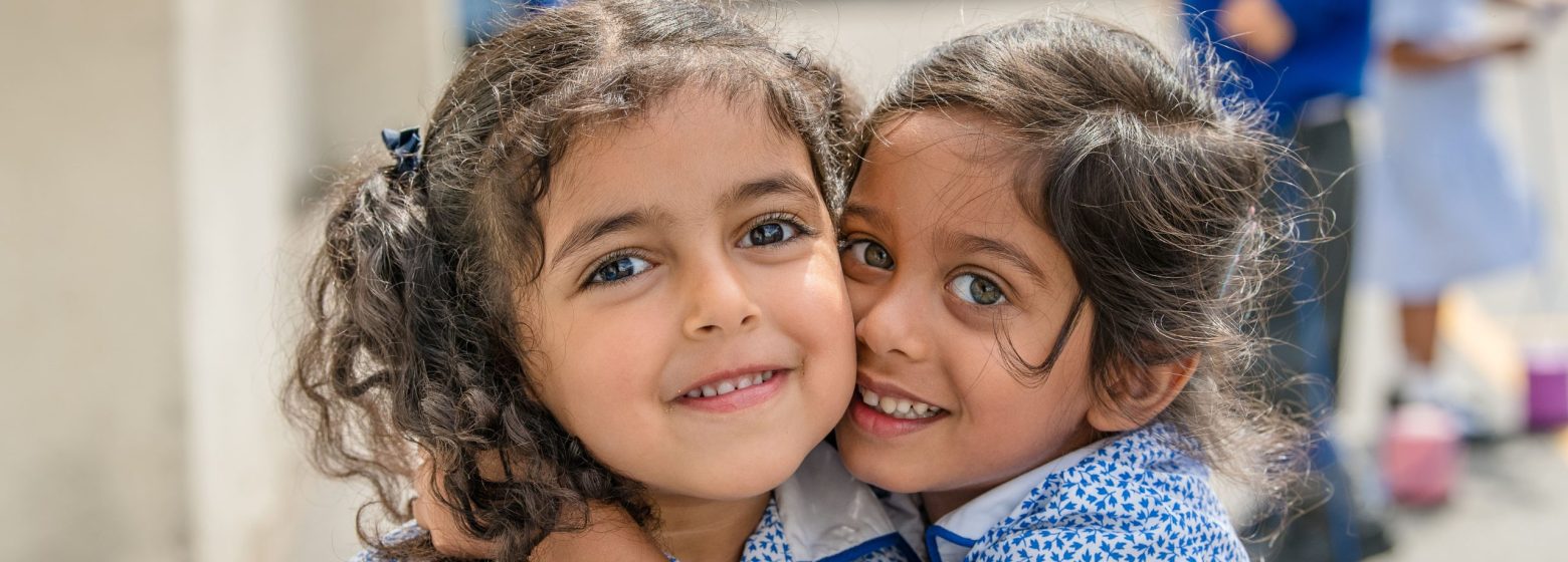 two girls smiling