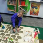 girl painting on the floor