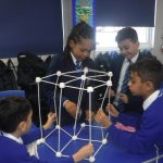 children building using straws and marshmallows