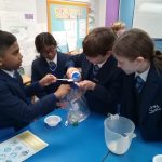 students doing a science experiment