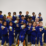 groups of students with their paper-made flowers