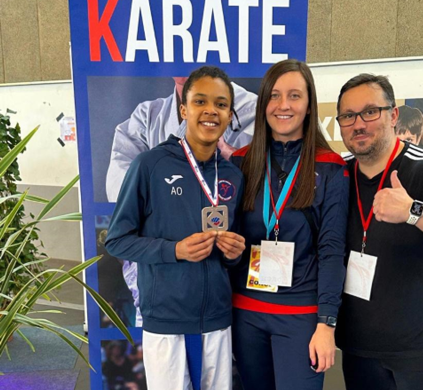 student with a medal
