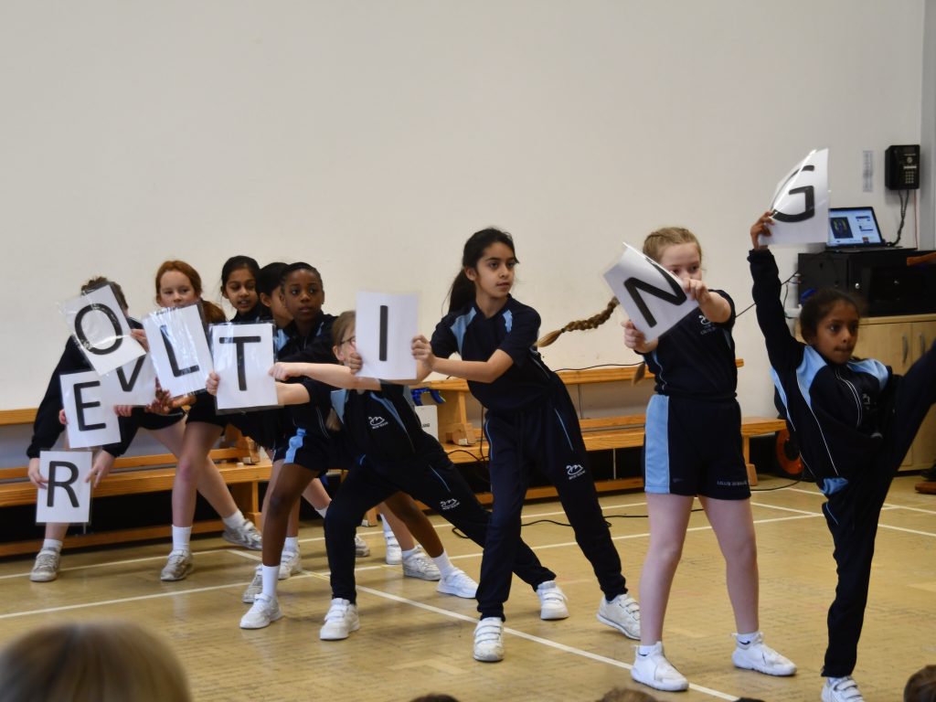 students holding letters