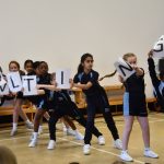 students holding letters