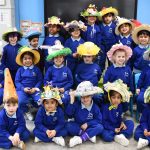 students in class wearing easter hats