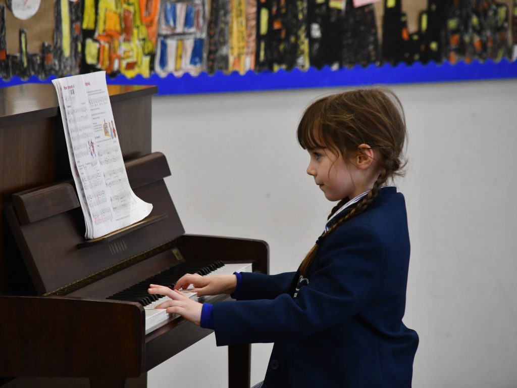 Pupil playing the piano
