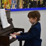 Pupil playing the piano