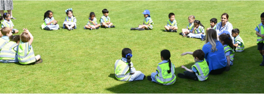 pupils sat on a field