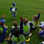 Young pupils sat in a field