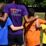 Children with arms around each other for the Rainbow Trust