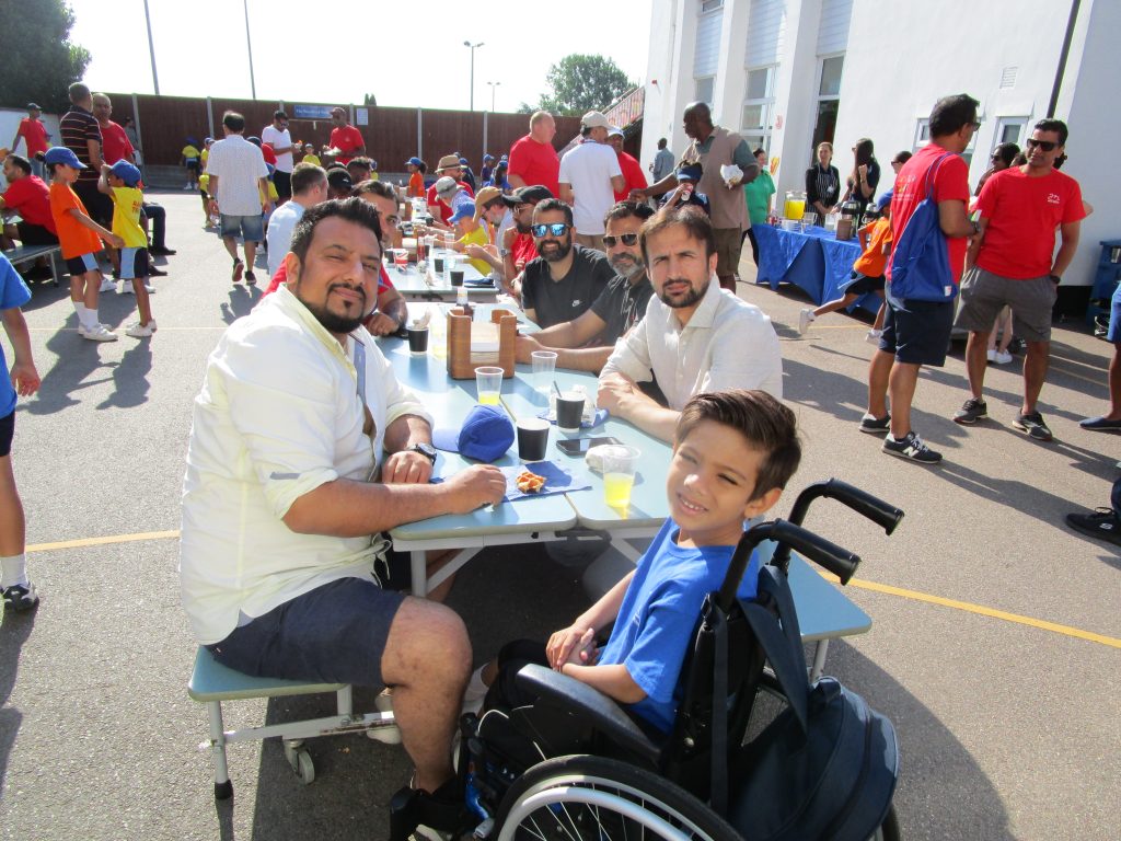 Parents and students eating at a table