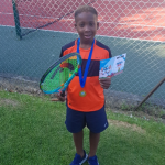 Boy holding a tennis racquet