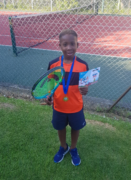 Boy holding a tennis racquet