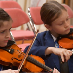 student playing music