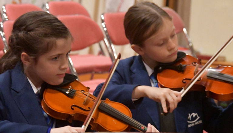 student playing music