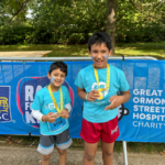 pupils holding medals
