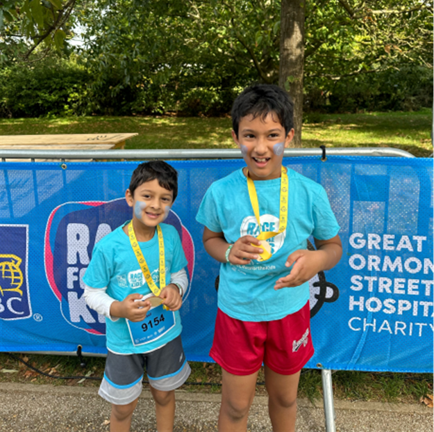 pupils holding medals
