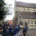 students pointing at a building