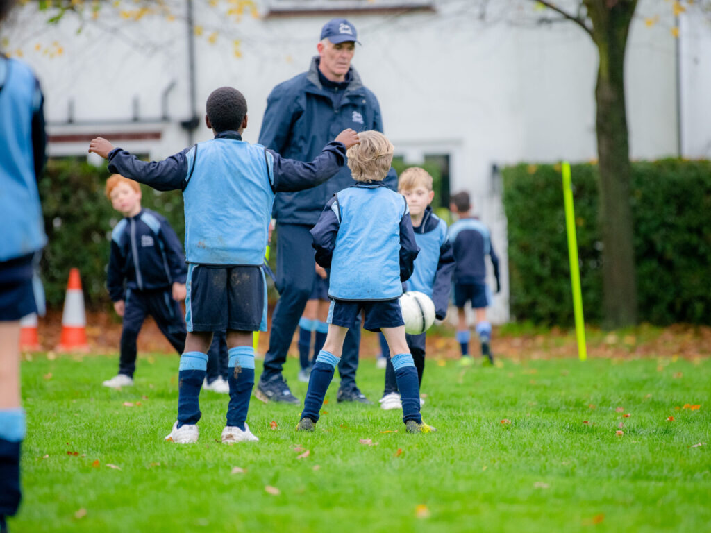 students playing football