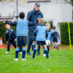 students playing football