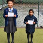 Students holding their awards