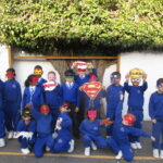 students wearing superhero masks