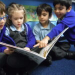 students reading a book