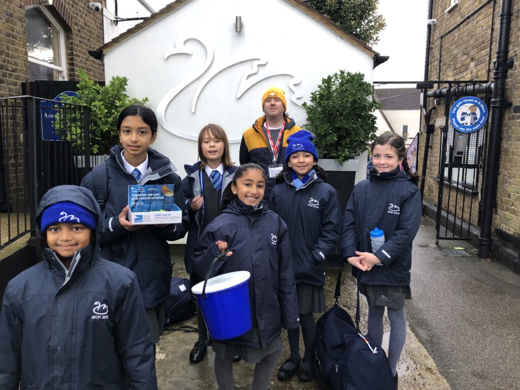 group of school children collecting money for charity
