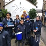 group of school children collecting money for charity