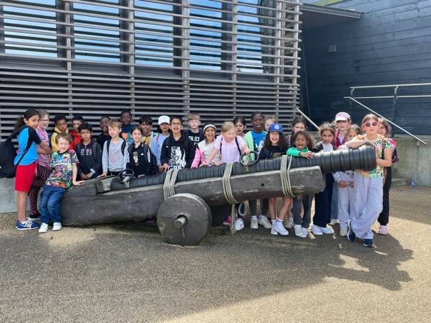 students holding a cannon