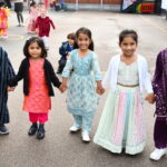 students in traditional clothing