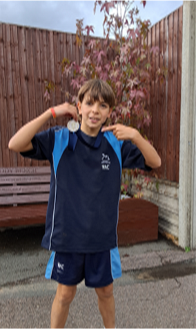 student with a medal