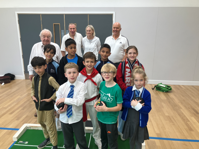 students bowling with elders