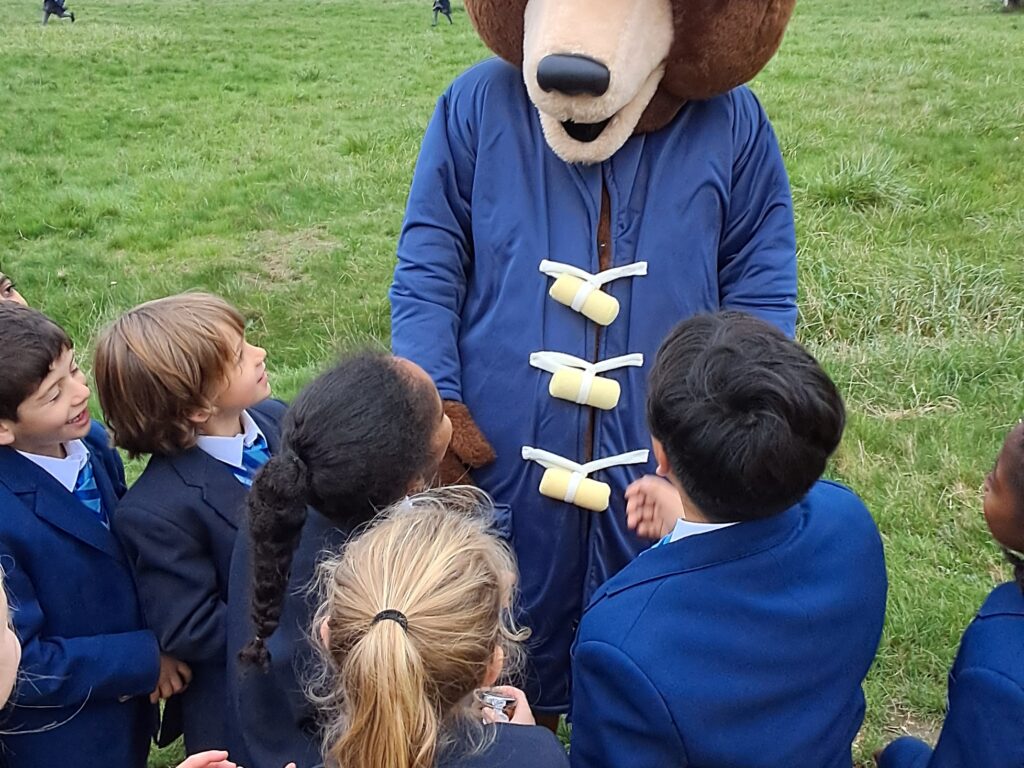 students with Paddington bear