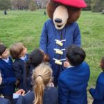 students with Paddington bear